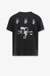 Black short-sleeved cotton t-shirt with bold black and white graphic of stylized faces erd text and hands holding guns by enfants riches déprimés