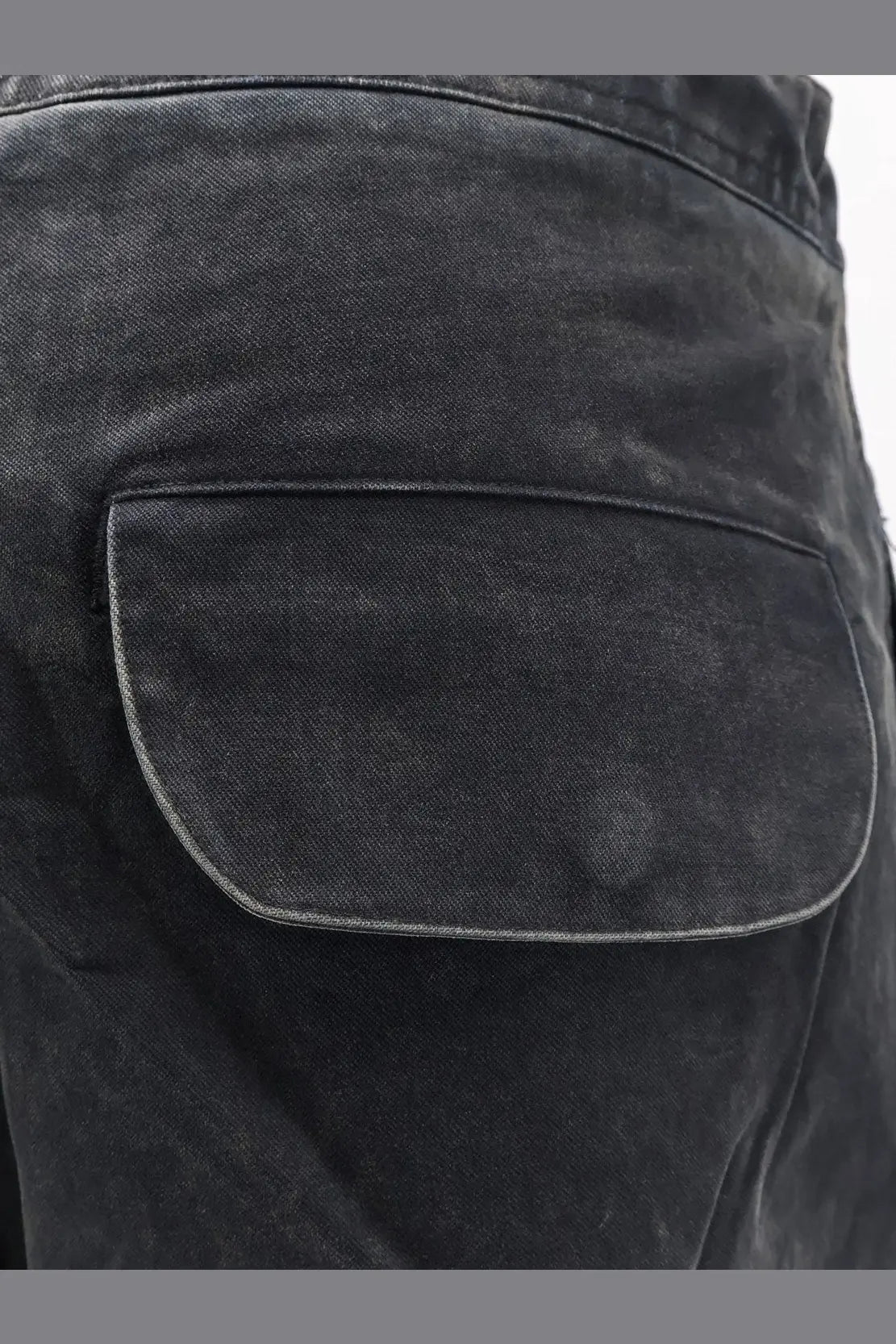 Black denim entire studios unisex barren cargo cotton trousers with faded texture and classic patch pocket on back