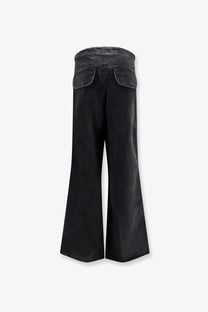 Black wide-leg denim trousers with relaxed fit and two back pockets shown from the back by entire studios unisex