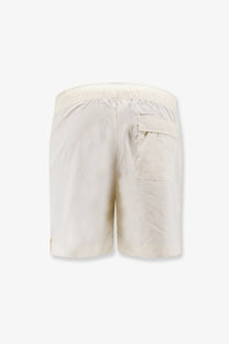 Cream-colored entire studios unisex cotton bermuda shorts with a relaxed fit and elastic waistband