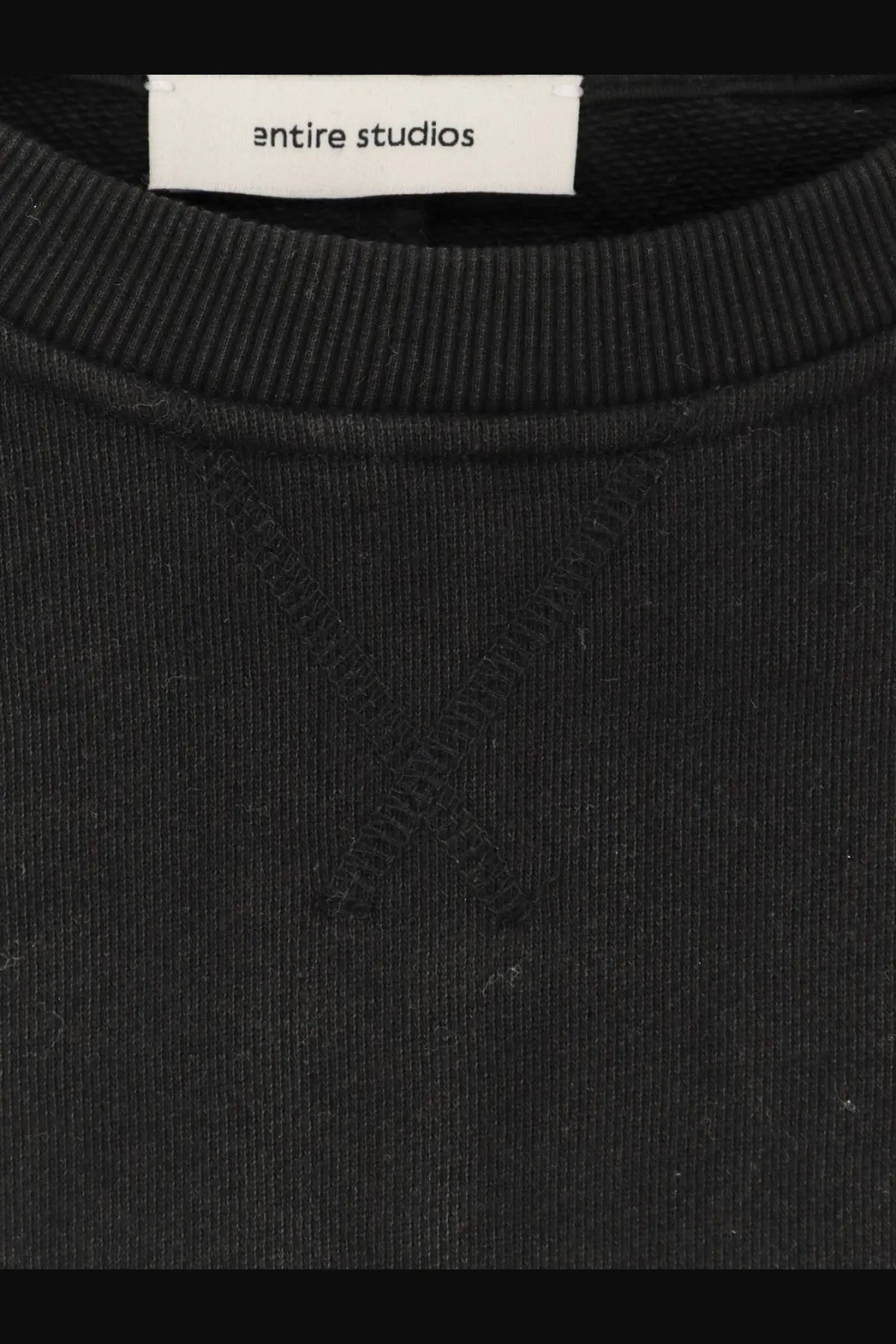 Black entire studios unisex pod crew sweatshirt with ribbed cotton fabric and subtle x-shaped seam detail