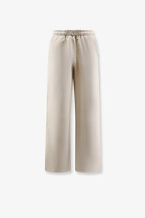 Entire studios women’s cotton jogging trousers in beige with wide-leg, elastic waistband, and subtle logo on left leg