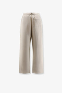 Beige entire studios women’s cotton wide-leg jogging trousers with elastic waistband and single side pocket