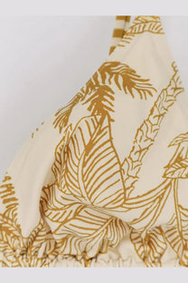 Eres women’s nylon bikini top in cream with a golden tropical leaf pattern and striped shoulder straps