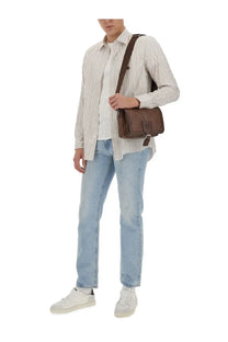 Brown leather crossbody bag with flap closure on ETRO Pegasus shirt display