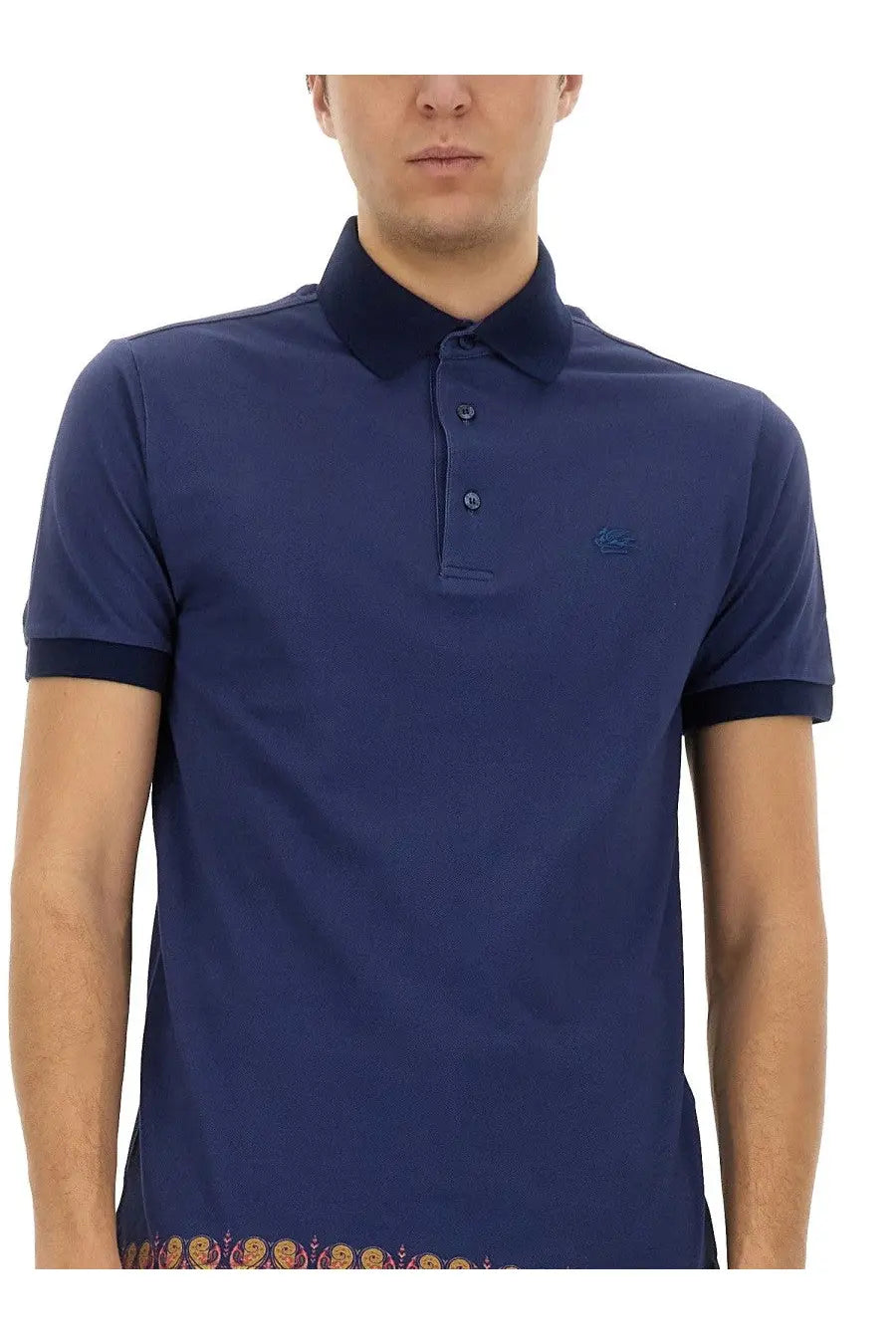 Etro men’s navy blue polo shirt with contrasting dark collar cuffs subtle embroidered logo and ornate patterned hem