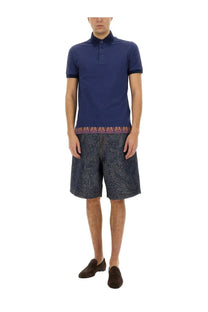 Navy blue ETRO men’s polo shirt with subtle patterned trim at the hem made of breathable fabric