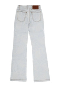 Light-wash denim flare jeans by etro with a brown leather brand patch at the waistband back view