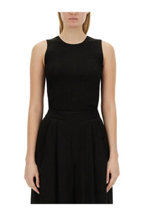 Fabiana filippi women’s black ribbed knit sleeveless top with high neckline paired with matching pleated skirt
