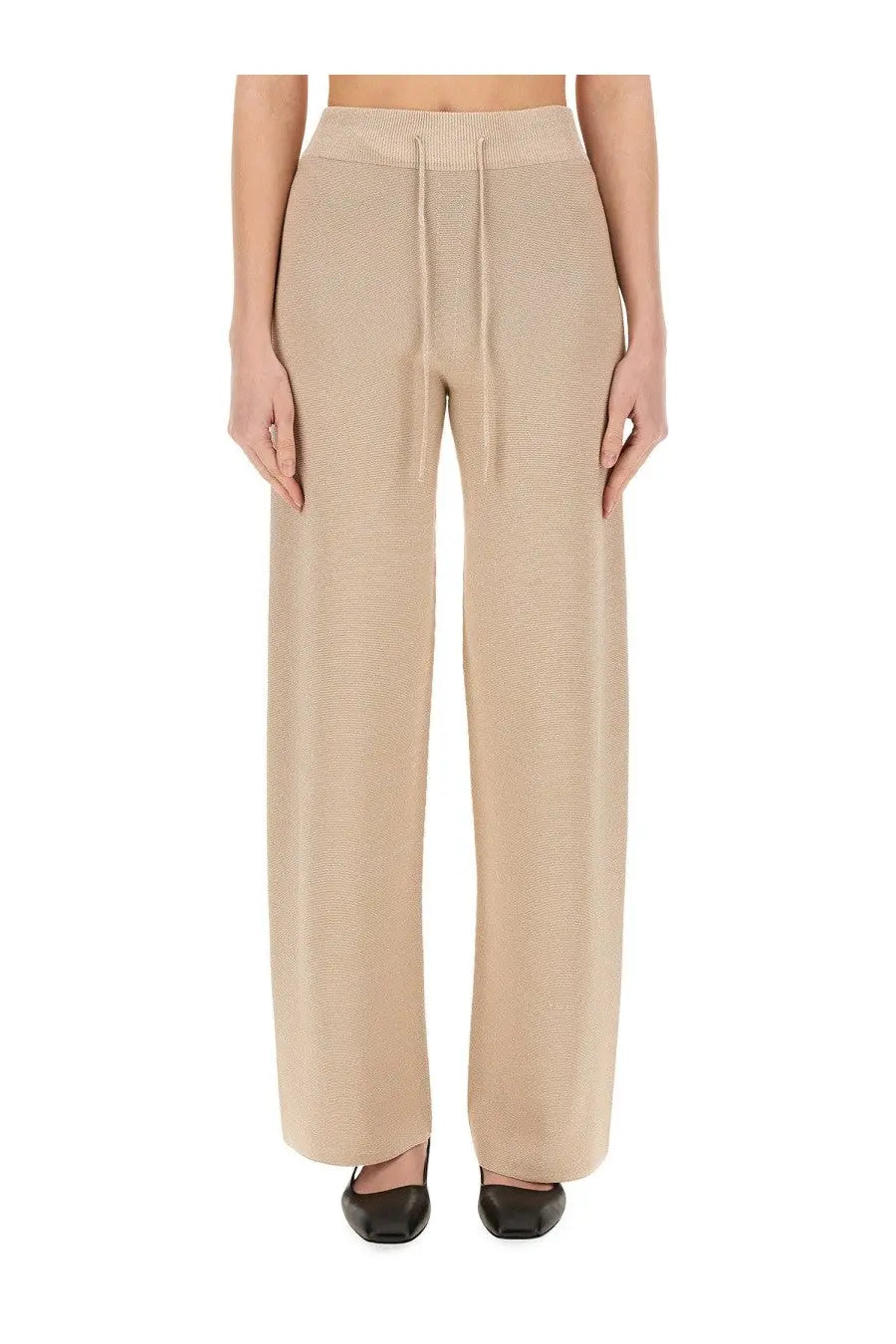 Beige wide-leg knit trousers with ribbed waistband and drawstring made of organic cotton and lurex by Fabiana Filippi
