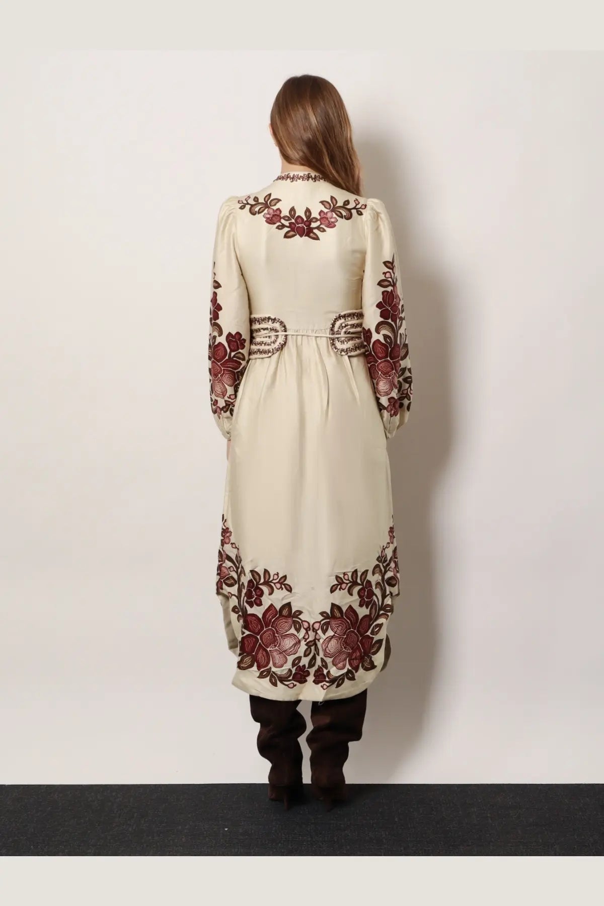 Cream-colored long coat with burgundy and brown floral embroidery on back sleeves and hem in FARM Rio style