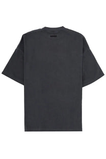 Black oversized Fear of God Essentials men’s training t-shirt with minimalist design and subtle ribbed neckline
