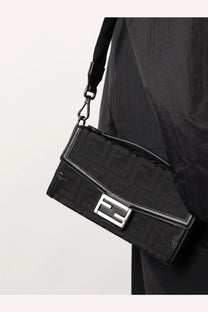 Fendi men’s baguette soft trunk black crossbody bag with repeating monogram fabric and silver-tone metal clasp