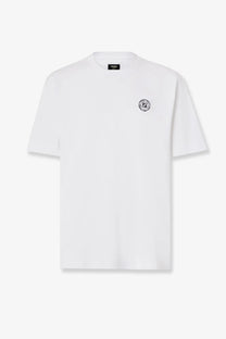 Fendi men’s white cotton t-shirt with small black circular logo on left chest and branded tag at neckline