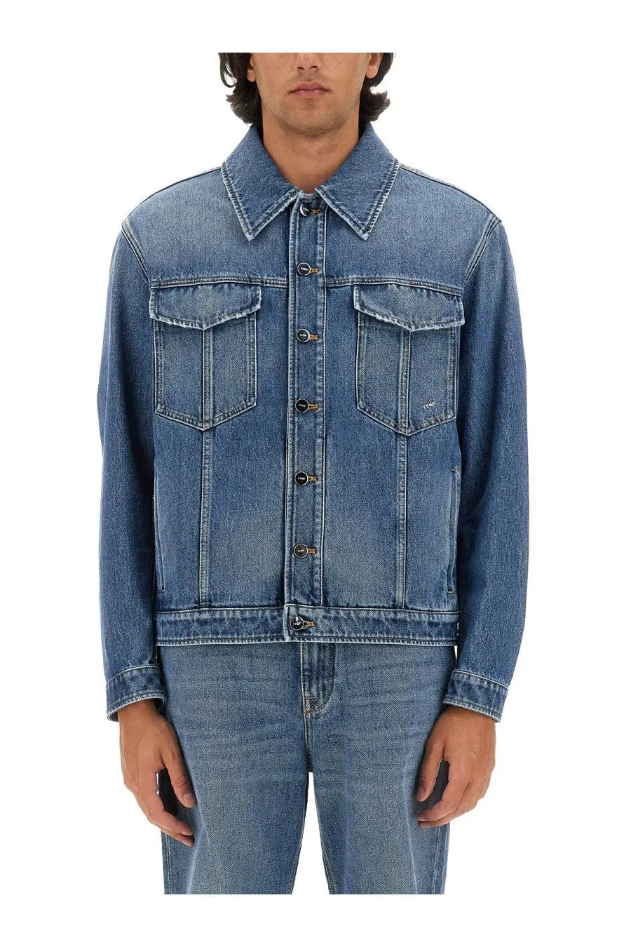 Fendi men’s medium-wash blue denim jacket with classic button-front closure and two chest pockets