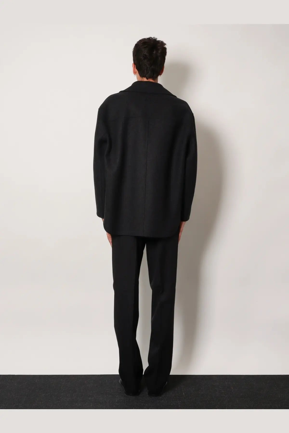 Black tailored blazer with structured silhouette and clean lines featured in fendi men’s double breasted wool felt peacoat grey