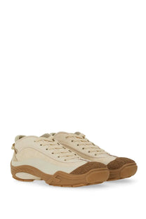 Cream-colored leather fendi men’s fendi lab sneaker with tan rubber soles and textured toe caps