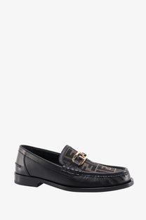 Black leather loafers for men by Fendi with gold-tone buckle and repeating ff logo pattern on upper