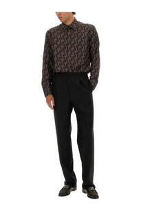 Black tailored trousers paired with fendi men’s printed silk shirt blue for a sleek modern look