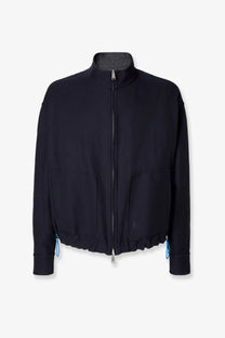 Fendi men’s reversible denim jacket blue featuring a black high collar jacket with front zipper and blue drawstring cuffs