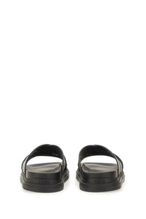 Fendi men’s black rubber slide sandal with thick chunky sole and two overlapping straps for casual wear