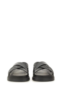 Fendi men’s slide sandal black with textured repeating logo straps and chunky rubber sole