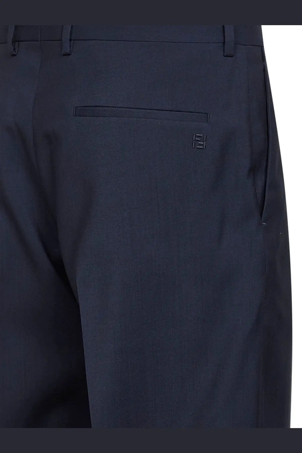 Back view of fendi men’s dark navy blue virgin wool tailored trousers with subtle embroidered logo on back pocket