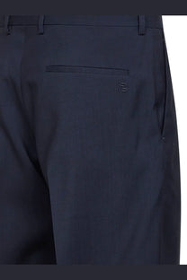 Back view of fendi men’s dark navy blue virgin wool tailored trousers with subtle embroidered logo on back pocket