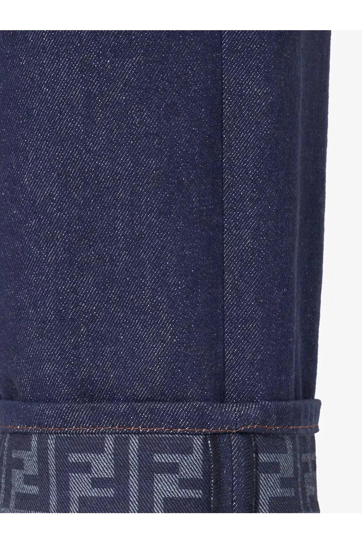 Fendi women’s blue denim jeans with dark blue material and repeating logo pattern on the rolled cuff