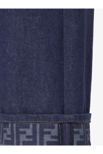 Fendi women’s blue denim jeans featuring dark blue fabric and a repeating logo pattern on the rolled cuff