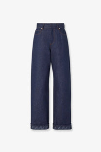 Fendi women’s blue denim jeans with wide-leg cut and rolled cuffs featuring a repeating ff logo pattern