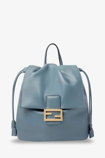 Fendi women’s leather backpack in light blue leather with gold-tone f-logo clasp and adjustable drawstring straps