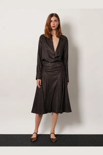 Black satin blouse with subtle leopard print pattern and long sleeves paired with fendi brown midi ff jacquard silk skirt