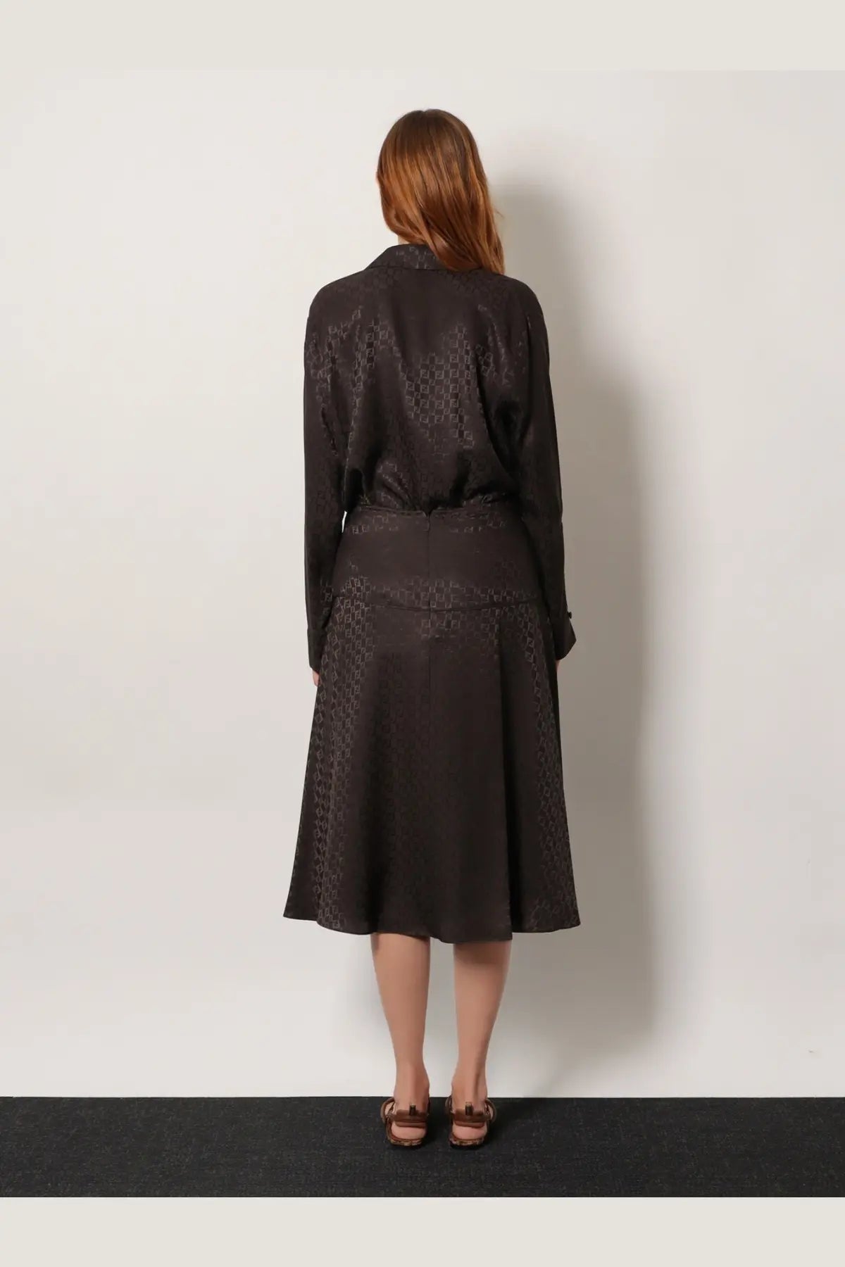 Fendi women’s midi silk skirt in brown with a subtle geometric pattern and flared design