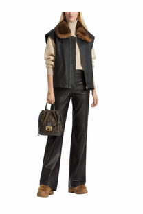 Fendi brown leather bucket bag with gold-tone ff logo hardware paired with black women’s sheepskin fur vest