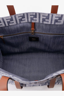Fendi women’s summer tote bag in denim jacquard fabric with brown leather handles and ff logo pattern on top edge