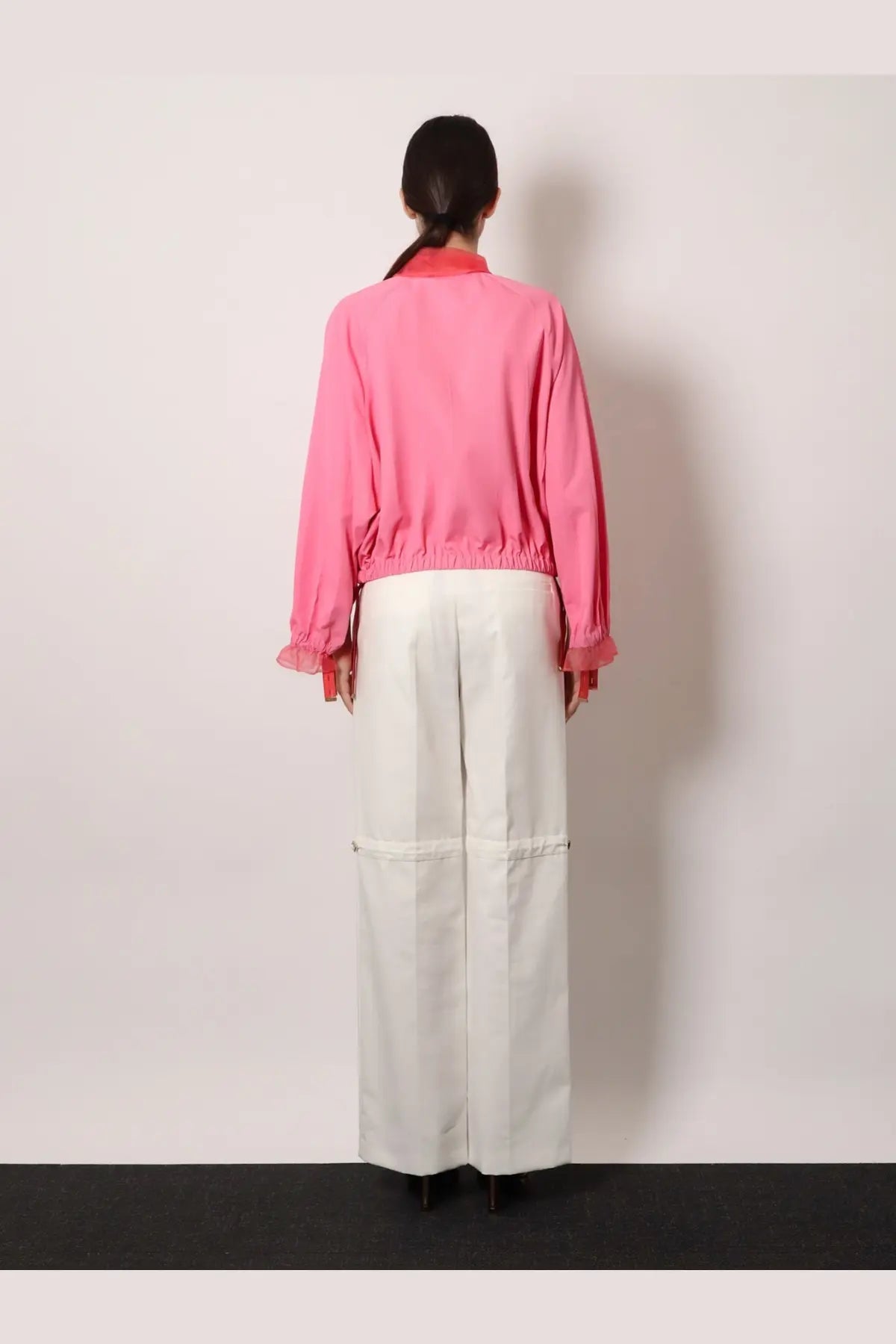 Fendi women’s technical viscose jacket azalea 26 in vibrant pink with ruffled cuffs and matching collar paired with white trousers