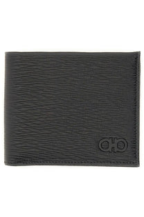Black textured leather Ferragamo men’s Gancini wallet with embossed logo for stylish everyday use