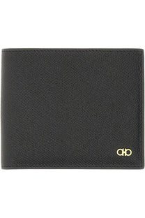 Ferragamo men’s gancini black wallet made of textured leather with a gold-tone logo emblem on the lower right corner