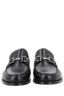 Ferragamo men’s moccasin black leather loafers with a signature silver-toned horsebit buckle front view
