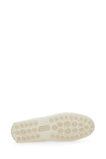 Cream-colored leather sole of ferragamo men’s white moccasin with circular tread pattern and small brand label