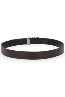 Black leather Ferragamo men’s reversible hooks belt with a silver-toned buckle and brown accents