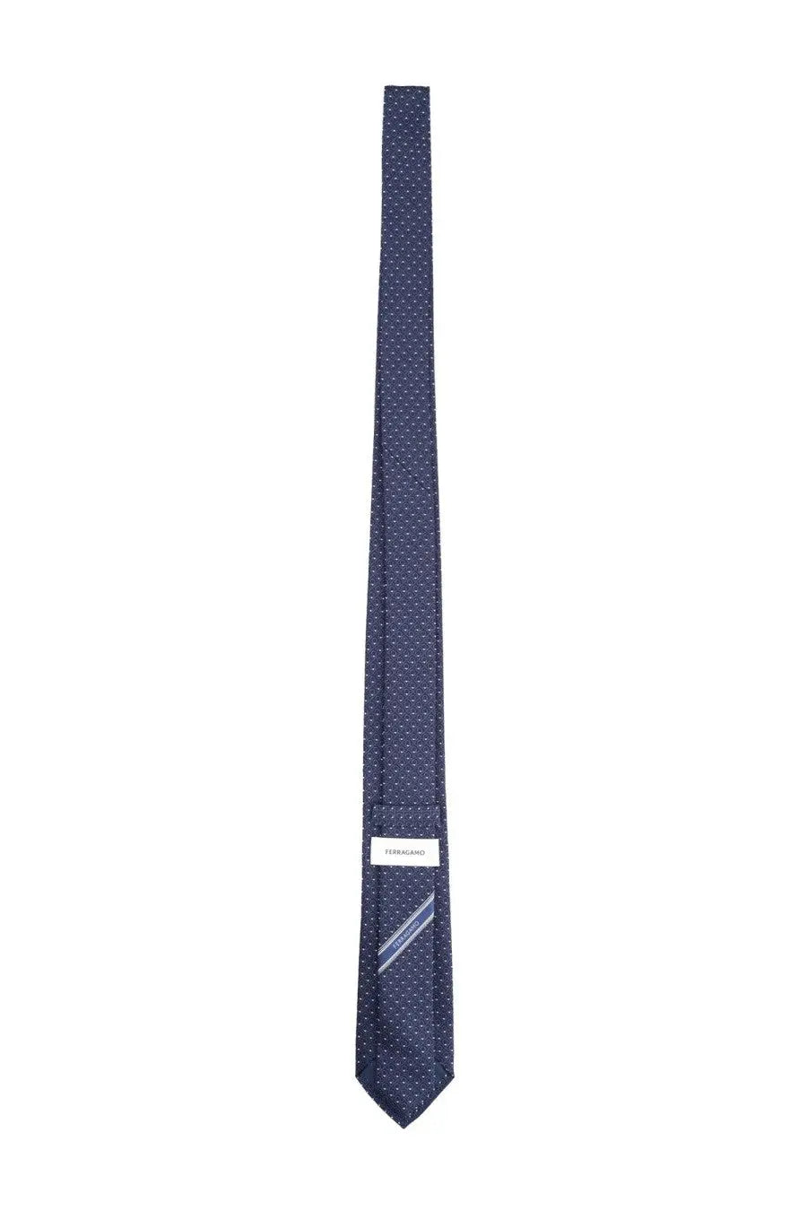 Ferragamo men’s silk tie blue with a subtle pattern of tiny white dots and brand label at the base