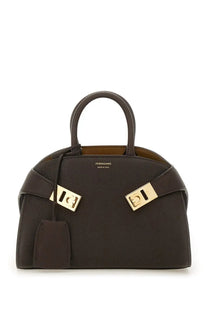 Ferragamo women’s borsa hug brown dark brown leather handbag with structured design and gold-tone metal clasp and handles
