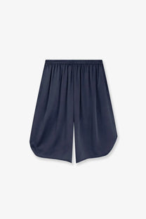 Navy blue silk bermuda shorts from the frankie shop with elastic waistband and relaxed flowing silhouette