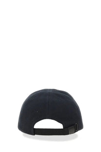 Black fred perry men’s baseball cap in blue with fabric strap and adjustable buckle shown from the back side