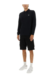 Black long-sleeved cotton polo shirt with white embroidered logo on chest from fred perry men’s blue collection