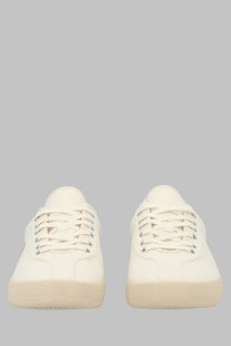 Fred Perry men’s fp tennis shoe in cream-colored poly canvas with white laces and silver eyelets
