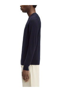 Navy blue long-sleeved knit sweater with subtle logo on the chest from Fred Perry men’s jersey blue collection