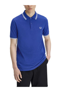 Royal blue Fred Perry men’s polo shirt with white collar and sleeve trim and embroidered laurel wreath logo on chest